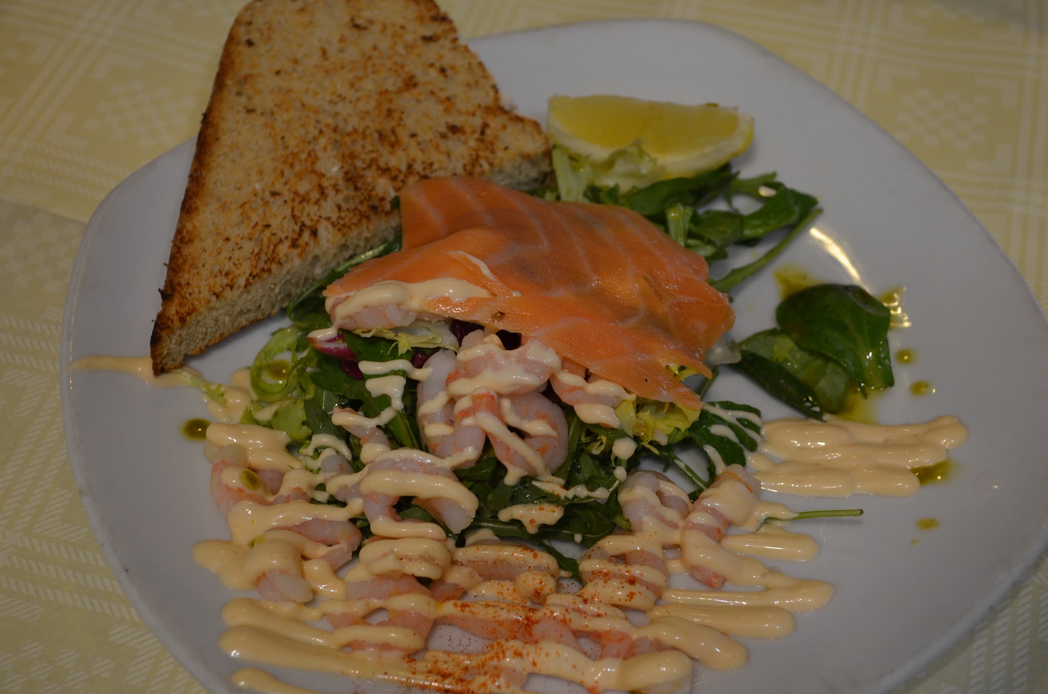 Smoked salmon and prawn salad with marie rose sauce, served with wholemeal toast and lemon