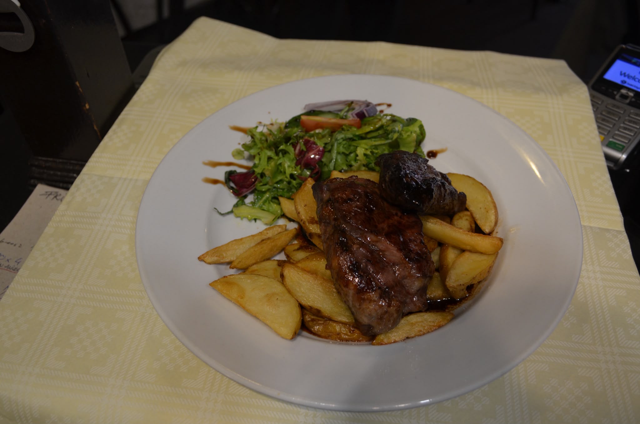 Chargrilled steak served on sautéed potatoes with a dressed side salad